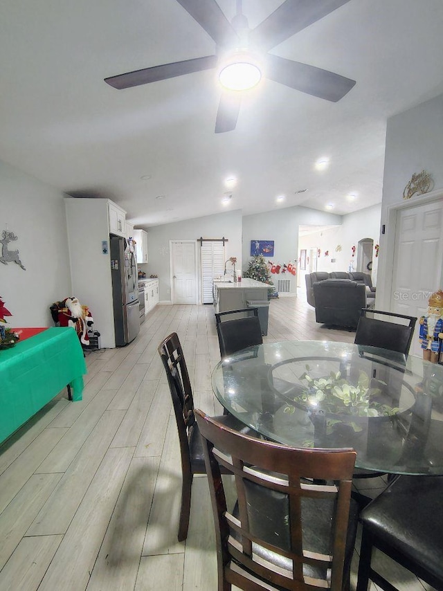 dining room with lofted ceiling