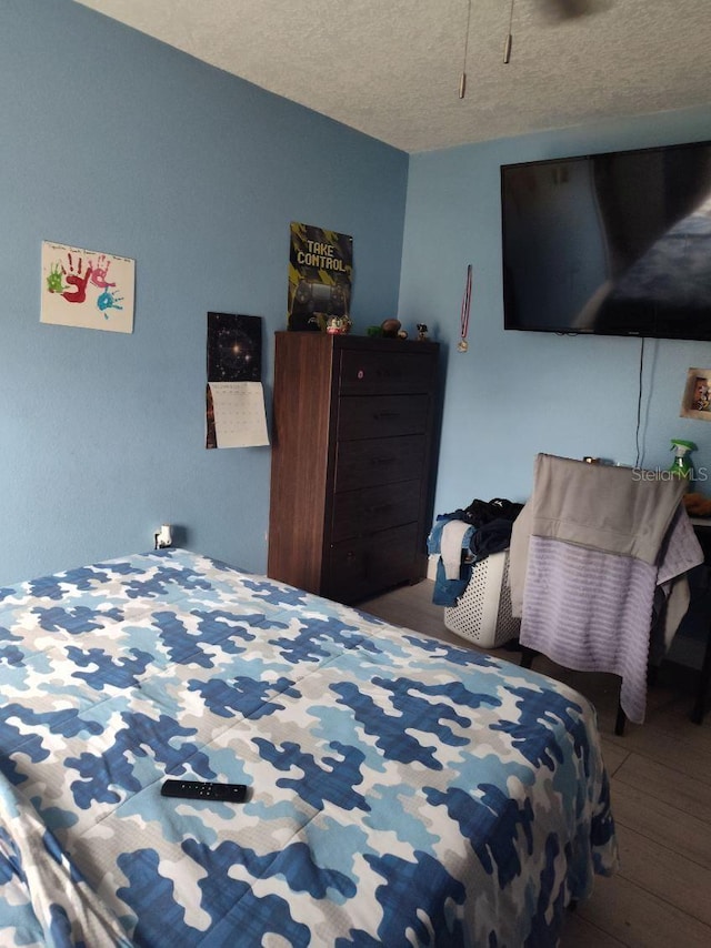 bedroom featuring a textured ceiling