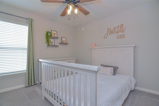 carpeted bedroom featuring ceiling fan