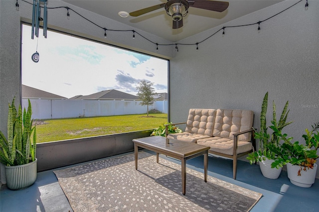 sunroom / solarium featuring ceiling fan