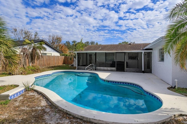 view of pool with a sunroom