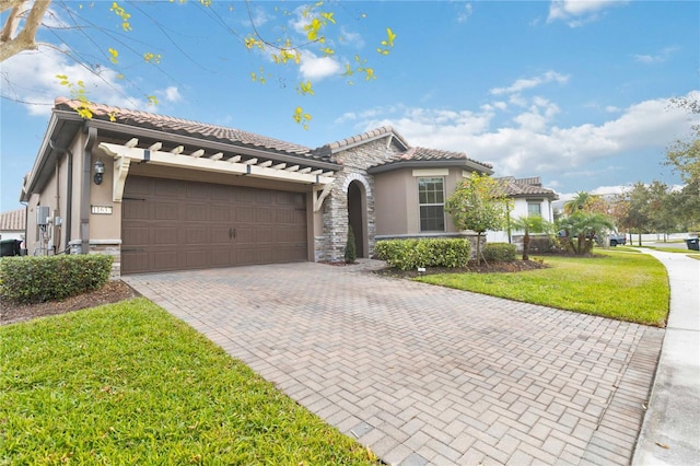 mediterranean / spanish-style house with a garage and a front lawn