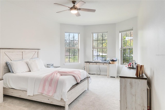 bedroom featuring ceiling fan and light colored carpet