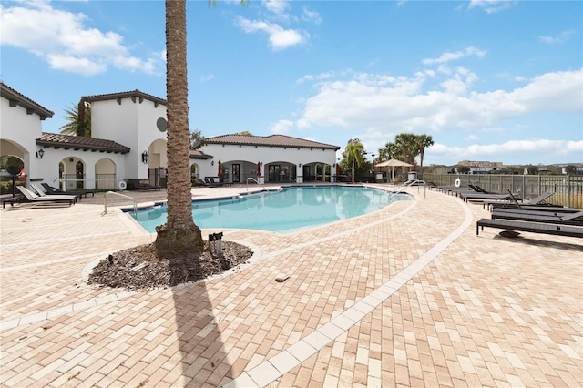 view of swimming pool featuring a patio