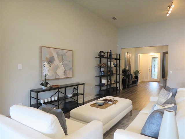 living room featuring baseboards and wood finished floors