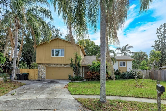 view of front facade featuring a front yard and a garage