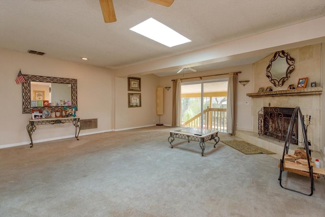 carpeted living room featuring a textured ceiling