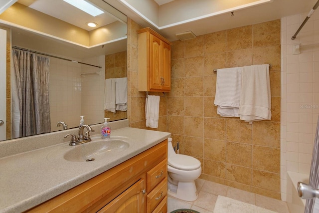 full bathroom with shower / tub combo with curtain, vanity, tile walls, and toilet