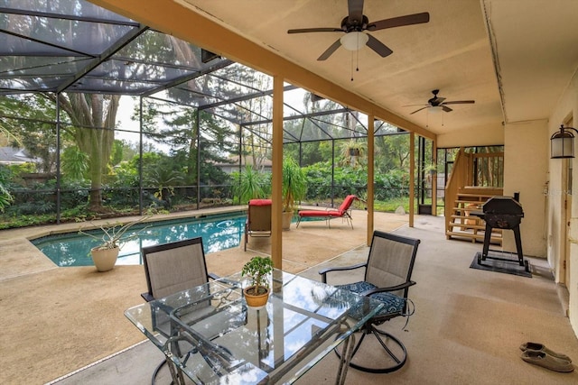 view of patio / terrace featuring glass enclosure, ceiling fan, and a grill