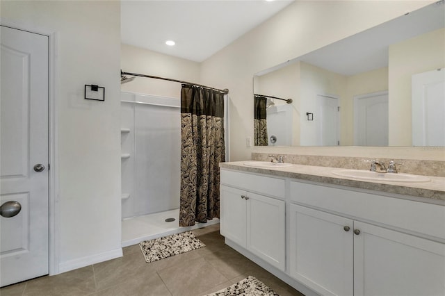 bathroom featuring a shower with shower curtain, vanity, and tile patterned floors