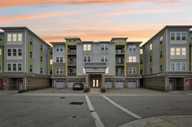 view of outdoor building at dusk