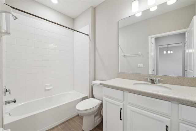 full bathroom with vanity, toilet, and tiled shower / bath