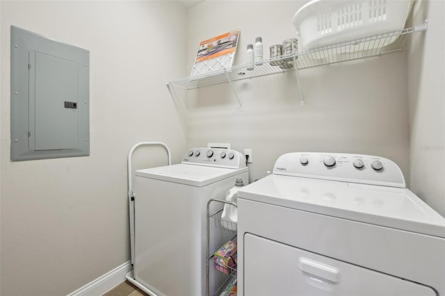 washroom with washing machine and dryer and electric panel