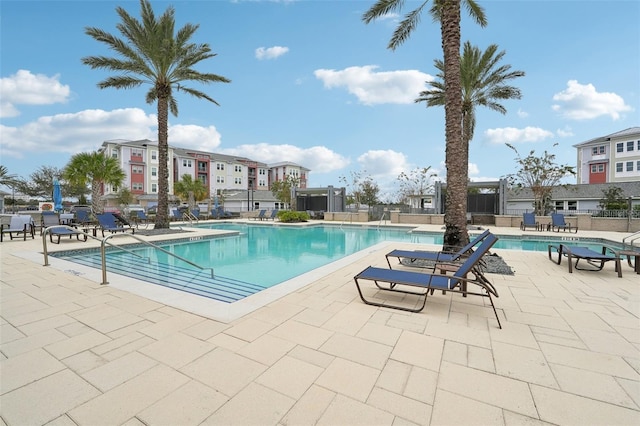 view of swimming pool with a patio