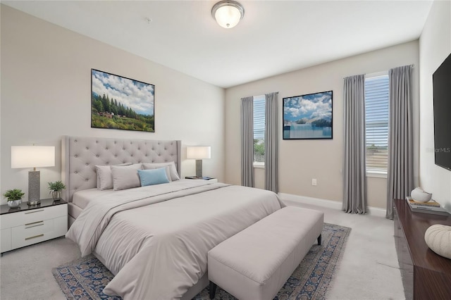 bedroom with light colored carpet