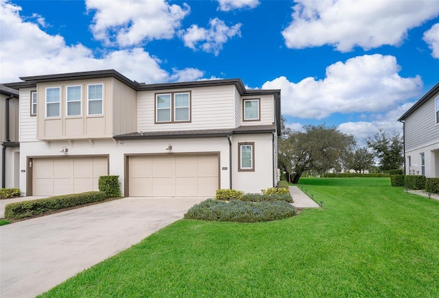 view of front of home featuring a front yard and a garage