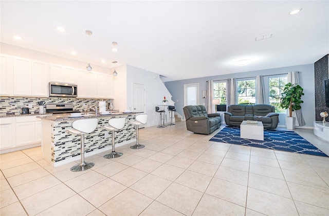 living room featuring light tile patterned flooring