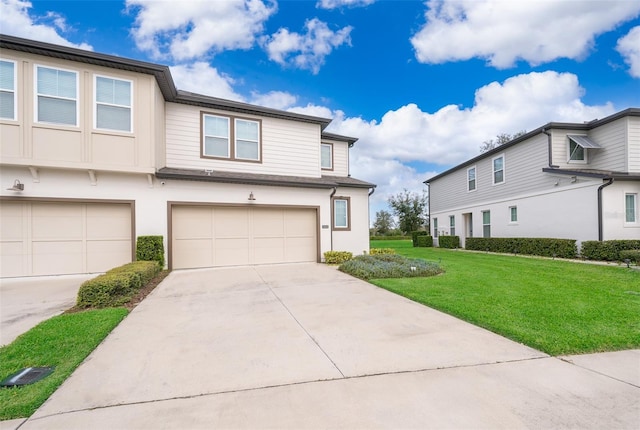 view of front of home featuring a garage and a front lawn