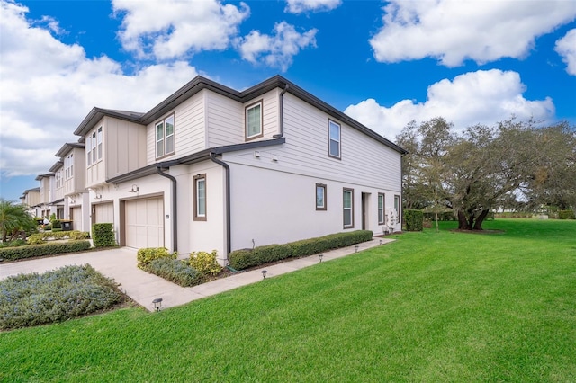 view of property exterior with a yard and a garage