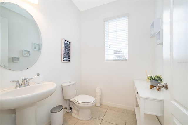 bathroom with tile patterned flooring and toilet