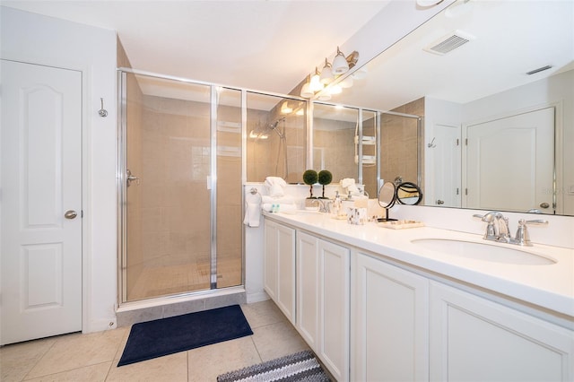 bathroom with vanity, tile patterned floors, and an enclosed shower