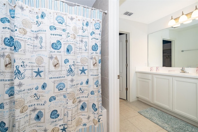 bathroom featuring tile patterned floors, curtained shower, and vanity