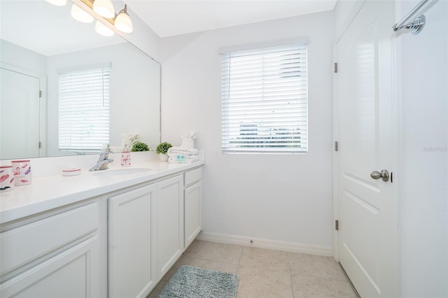 bathroom featuring tile patterned floors and vanity