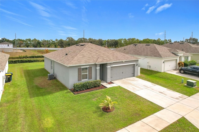 ranch-style home featuring a garage, a front yard, and central AC