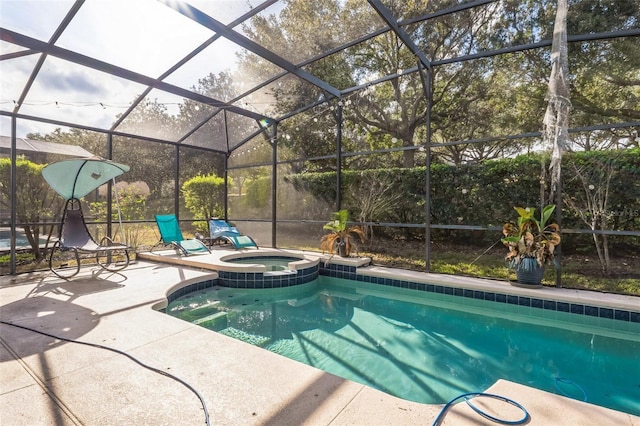 view of swimming pool with a patio area, a lanai, and an in ground hot tub