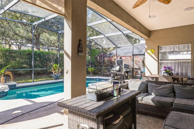 view of pool with a patio area, ceiling fan, and outdoor lounge area