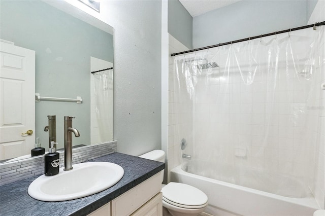 full bathroom featuring shower / bath combination with curtain, vanity, and toilet