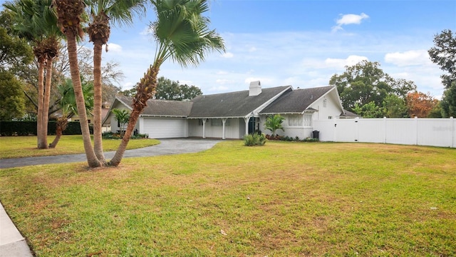 view of front facade featuring a front lawn and a garage