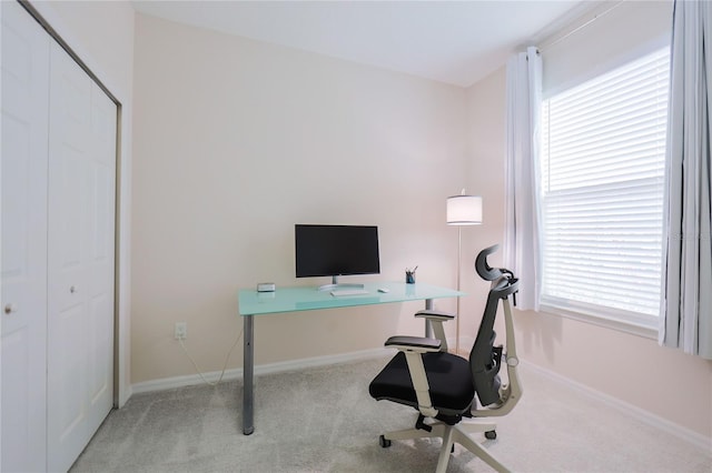 carpeted home office featuring a wealth of natural light