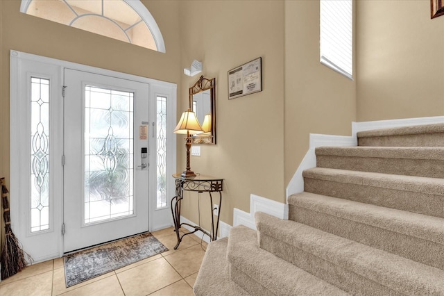 tiled foyer featuring plenty of natural light