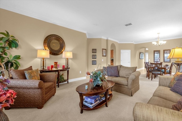 carpeted living room with crown molding and an inviting chandelier