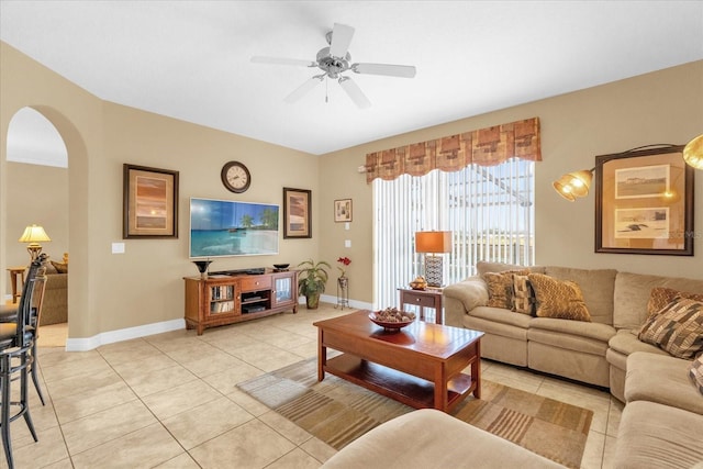 living room featuring light tile patterned floors and ceiling fan