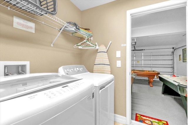 clothes washing area with washer and dryer and pool table