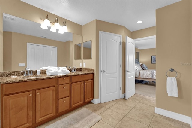 bathroom featuring tile patterned flooring and vanity