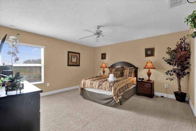 bedroom featuring ceiling fan and light colored carpet