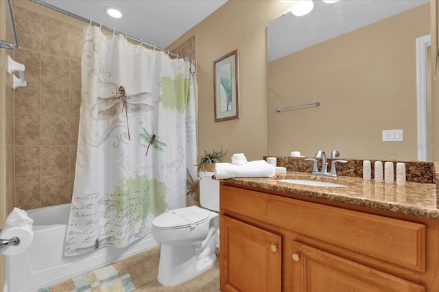 full bathroom featuring tile patterned flooring, vanity, toilet, and shower / bath combo with shower curtain