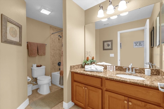 full bathroom with tile patterned floors, toilet, vanity, and tiled shower / bath