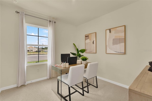 carpeted home office with a healthy amount of sunlight