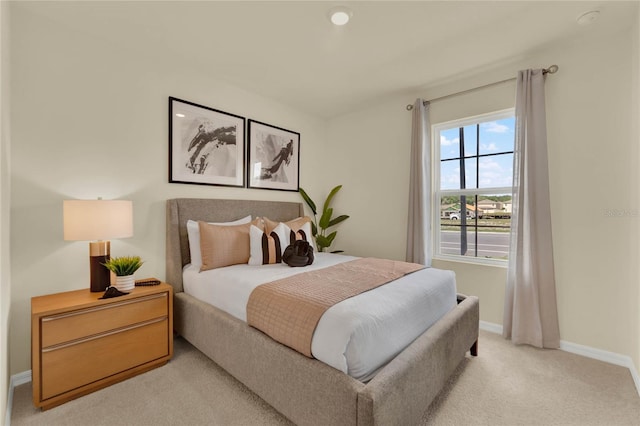 bedroom with light colored carpet