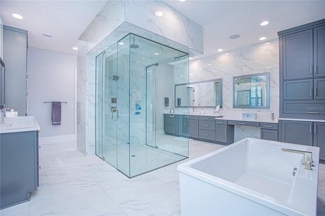 bathroom featuring a marble finish shower, recessed lighting, and marble finish floor