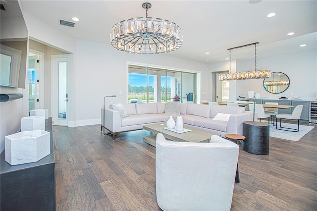 living room featuring visible vents, a notable chandelier, wood finished floors, and recessed lighting