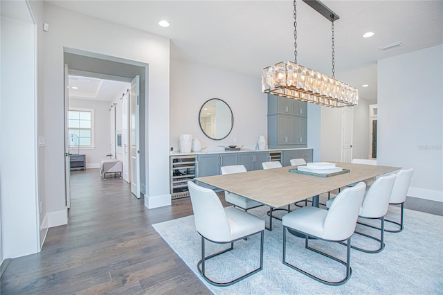 dining space featuring visible vents, baseboards, dark wood finished floors, recessed lighting, and wine cooler