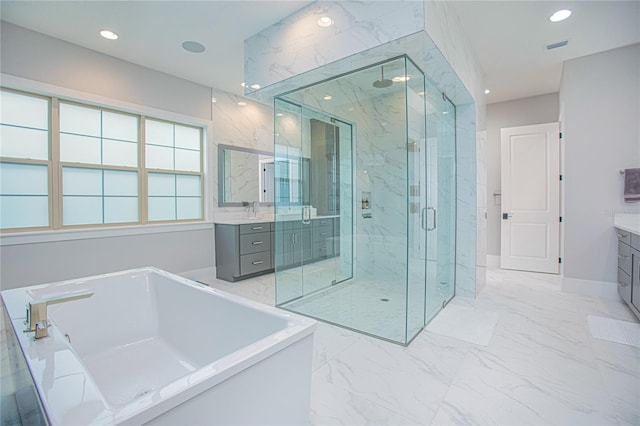 full bathroom featuring a marble finish shower, marble finish floor, and vanity