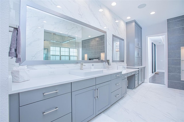 bathroom with vanity, recessed lighting, walk in shower, tile walls, and marble finish floor