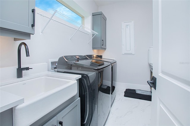 washroom with electric panel, cabinet space, separate washer and dryer, a sink, and marble finish floor