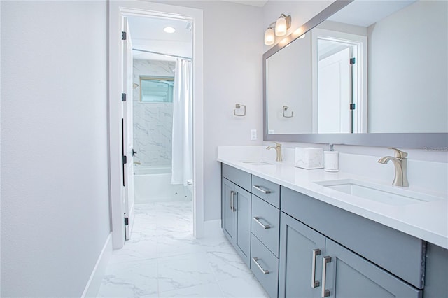 bathroom with a sink, baseboards, and marble finish floor